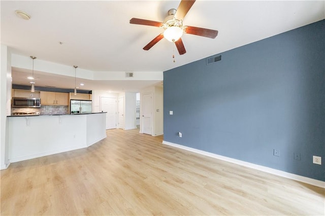 390 17th St NW Unit 2053, Atlanta, GA 30363 - unfurnished living room with a ceiling fan and light wood finished floors