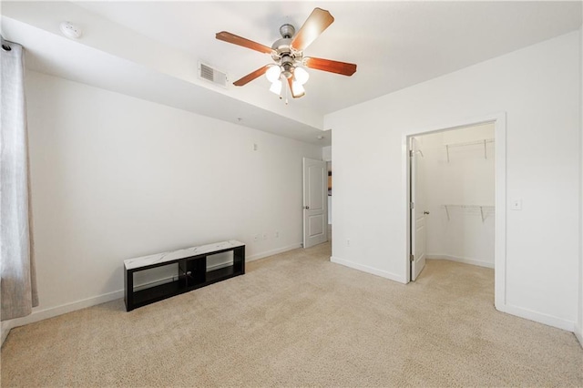 390 17th St NW Unit 2053, Atlanta, GA 30363 - unfurnished bedroom with light colored carpet, a walk in closet, and ceiling fan