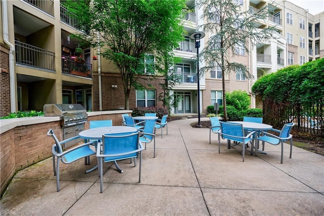 390 17th St NW Unit 2053, Atlanta, GA 30363 - view of patio / terrace featuring outdoor dining space and an outdoor kitchen