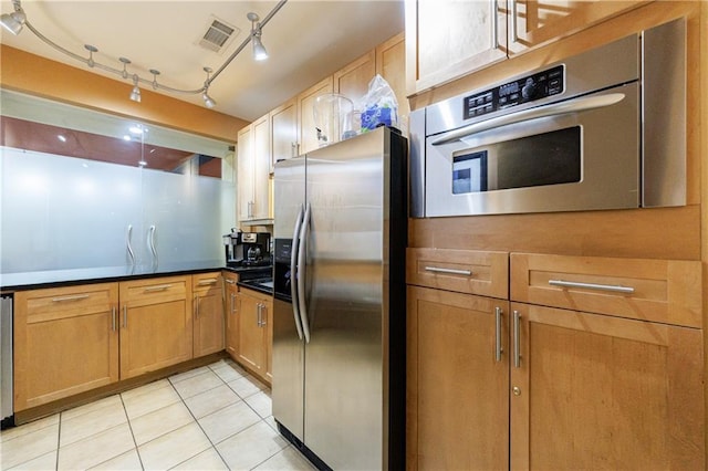 390 17th St NW Unit 2053, Atlanta, GA 30363 - kitchen with stainless steel appliances, light tile patterned floors, and dark countertops