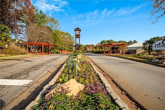 view of road with curbs and sidewalks