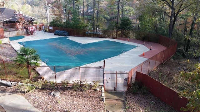 view of pool with a fenced in pool, fence private yard, and a patio