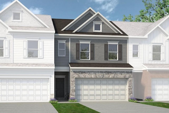 townhome / multi-family property featuring driveway, stone siding, an attached garage, and a shingled roof