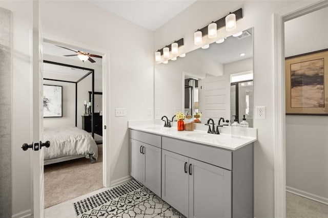 full bathroom featuring connected bathroom, a sink, ceiling fan, and double vanity