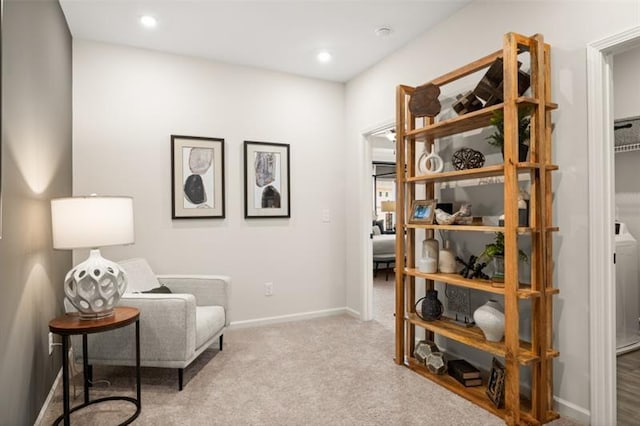 living area featuring carpet, baseboards, and recessed lighting