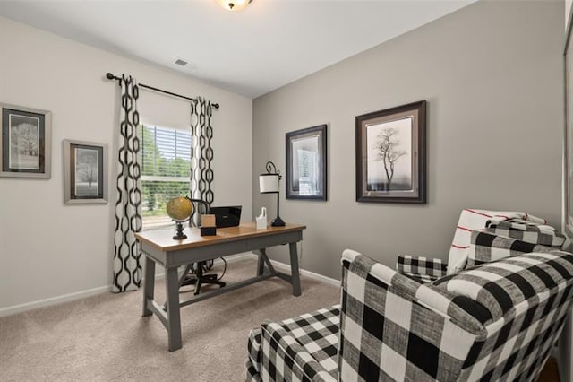 carpeted office with visible vents and baseboards