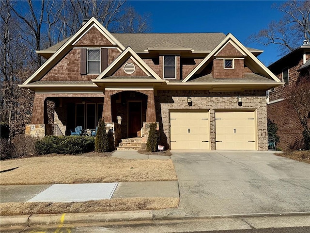 136 Timothy Park Ln, Athens, GA 30606 - craftsman-style home featuring an attached garage, driveway, a porch, brick siding, and roof with shingles
