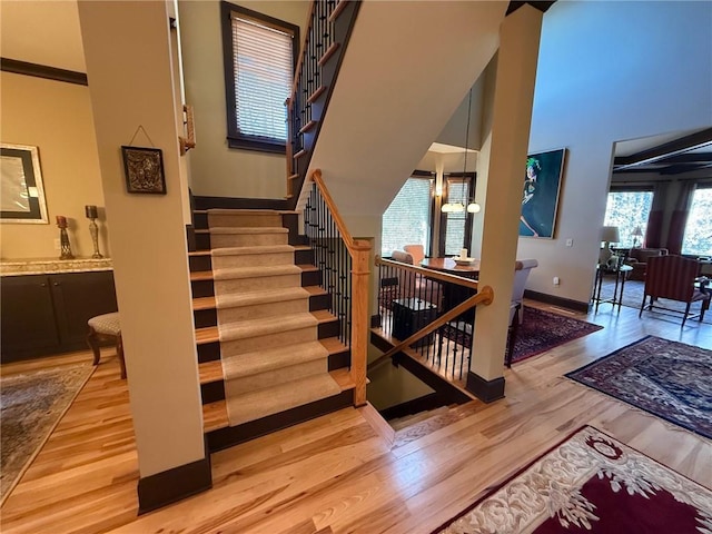 136 Timothy Park Ln, Athens, GA 30606 - stairs featuring wood finished floors and baseboards