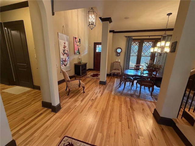 136 Timothy Park Ln, Athens, GA 30606 - dining space featuring a chandelier, light wood finished floors, baseboards, and ornamental molding