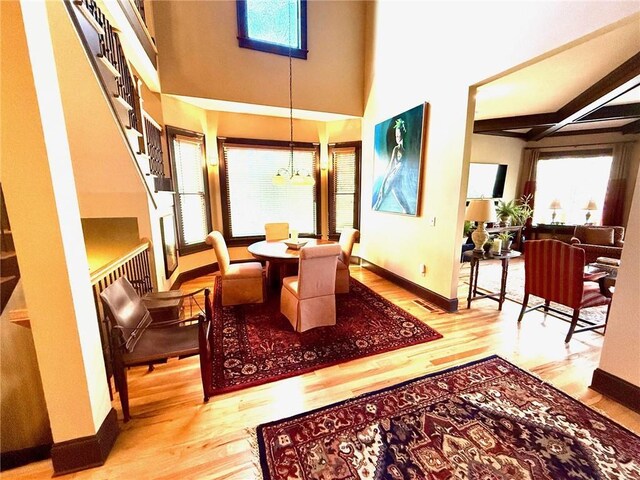 136 Timothy Park Ln, Athens, GA 30606 - dining room with a chandelier, wood finished floors, and baseboards