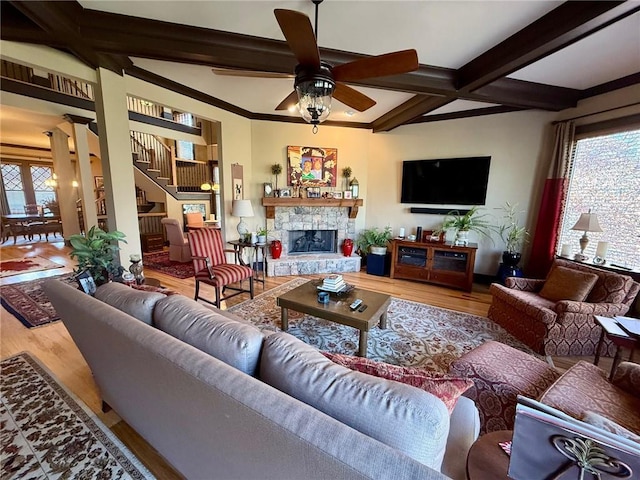 136 Timothy Park Ln, Athens, GA 30606 - living area featuring wood finished floors, a ceiling fan, beam ceiling, stairs, and a fireplace