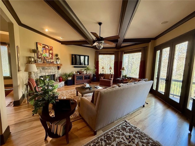136 Timothy Park Ln, Athens, GA 30606 - living area featuring a ceiling fan, light wood-type flooring, a fireplace, ornamental molding, and beam ceiling