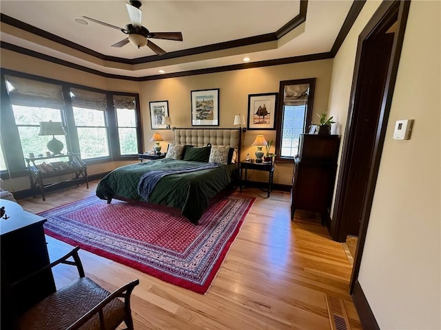136 Timothy Park Ln, Athens, GA 30606 - bedroom with ornamental molding, a raised ceiling, light wood finished floors, baseboards, and a ceiling fan