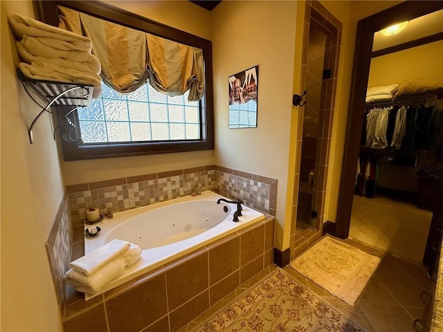 136 Timothy Park Ln, Athens, GA 30606 - full bathroom with a shower stall, tile patterned flooring, a tub with jets, and a spacious closet