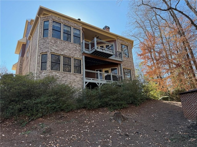 136 Timothy Park Ln, Athens, GA 30606 - rear view of property featuring a balcony, a chimney, and brick siding