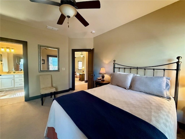 136 Timothy Park Ln, Athens, GA 30606 - bedroom with ensuite bathroom, light colored carpet, baseboards, a ceiling fan, and a sink
