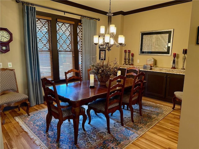 136 Timothy Park Ln, Athens, GA 30606 - dining room featuring a chandelier, light wood finished floors, and ornamental molding
