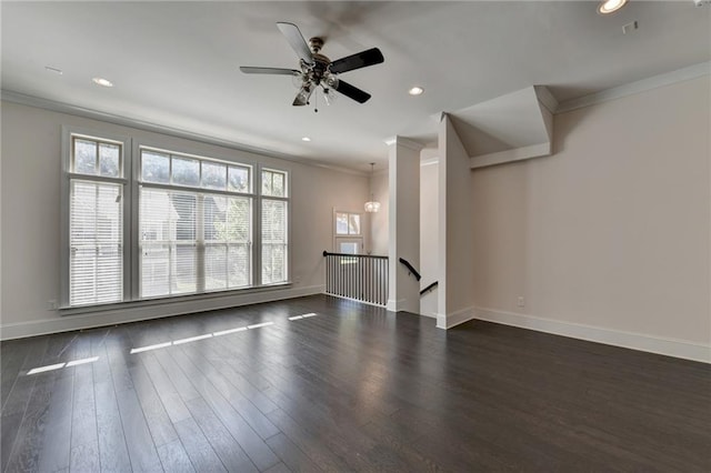 unfurnished living room featuring ceiling fan, ornamental molding, and dark hardwood / wood-style flooring