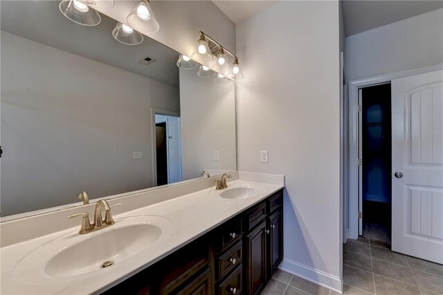 bathroom with tile patterned flooring and vanity