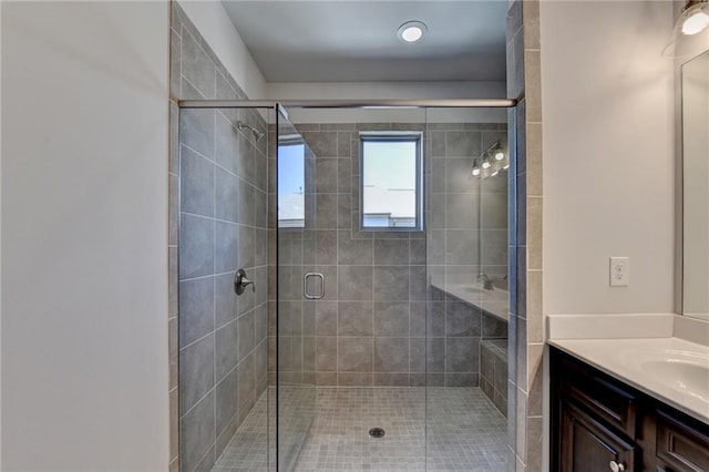 bathroom featuring vanity and an enclosed shower