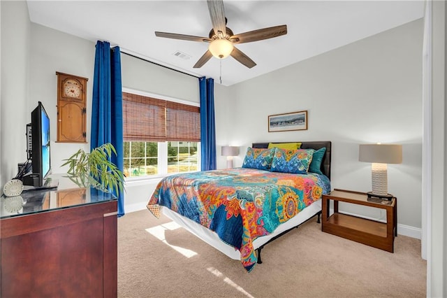 carpeted bedroom featuring ceiling fan