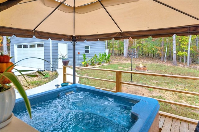 view of swimming pool featuring a hot tub and a lawn