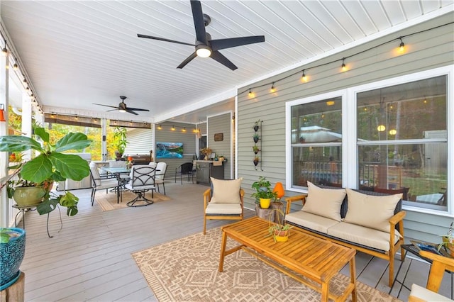 wooden deck with an outdoor living space