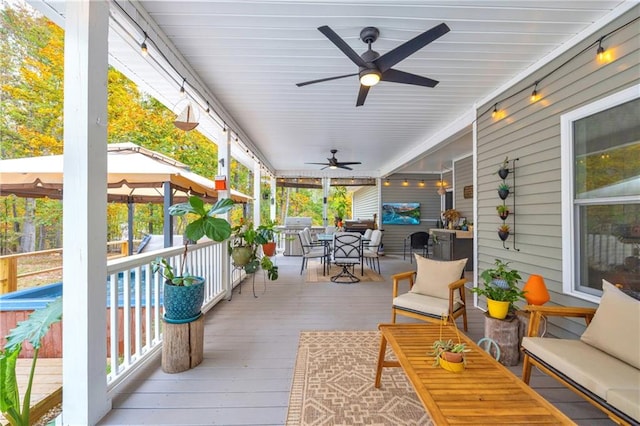 wooden terrace featuring a gazebo