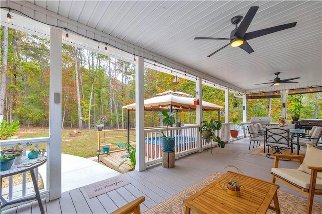 exterior space with a gazebo and ceiling fan