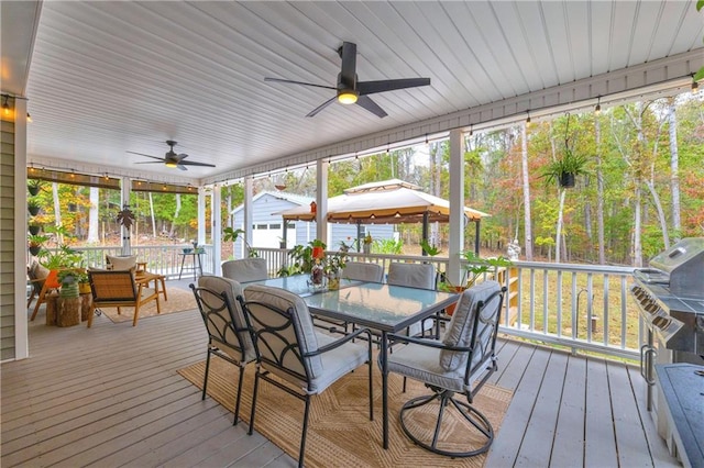 sunroom / solarium with ceiling fan