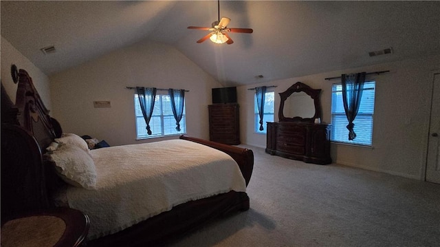 bedroom with ceiling fan, lofted ceiling, and carpet