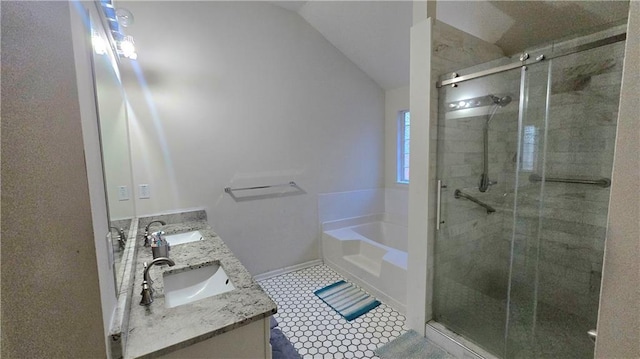 bathroom featuring vanity, tile patterned flooring, lofted ceiling, and plus walk in shower