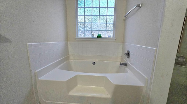 bathroom with a washtub