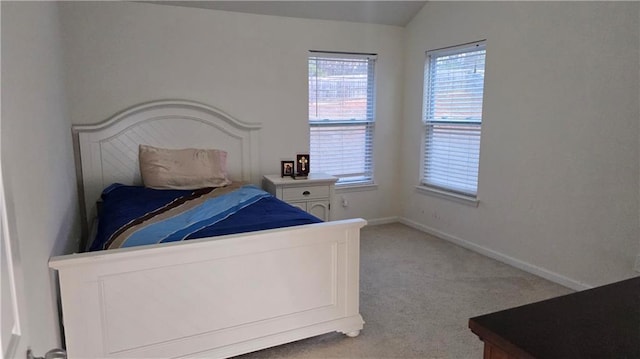 carpeted bedroom featuring vaulted ceiling