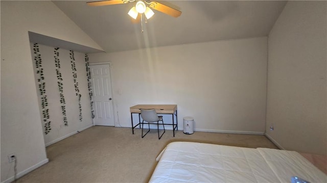 carpeted bedroom featuring lofted ceiling and ceiling fan