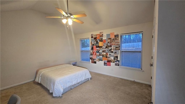 carpeted bedroom featuring lofted ceiling and ceiling fan