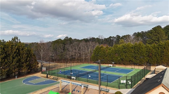 view of tennis court featuring basketball hoop