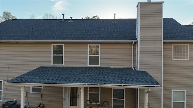 back of house featuring central AC