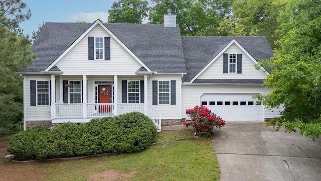 view of front facade with a garage, covered porch, a chimney, a shingled roof, and concrete driveway