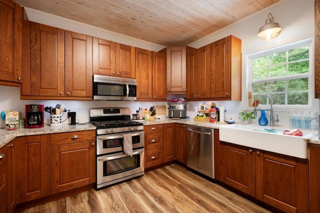 kitchen featuring wooden ceiling, stainless steel appliances, brown cabinets, and light wood-style flooring