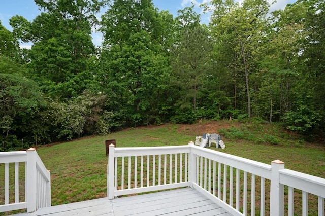 wooden deck with a lawn