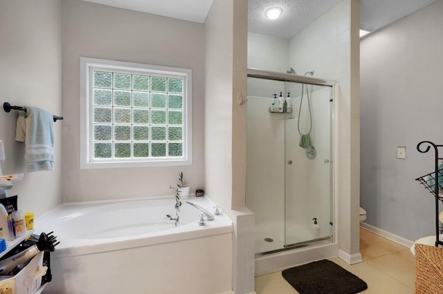 full bath featuring tile patterned flooring, a bath, toilet, and a shower stall