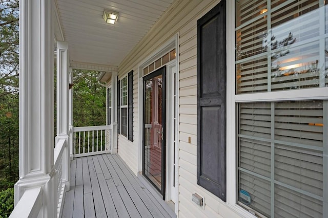 wooden terrace featuring a porch