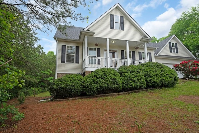 view of front of home featuring a porch, a garage, and roof with shingles