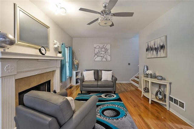 4321 Clairesbrook Ln, Acworth, GA 30101 - living area with a ceiling fan, a fireplace, stairway, and wood finished floors