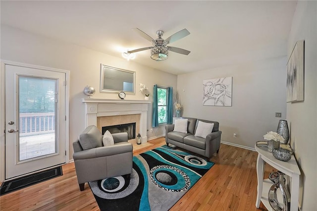 4321 Clairesbrook Ln, Acworth, GA 30101 - living area with wood finished floors, ceiling fan, a premium fireplace, and baseboards