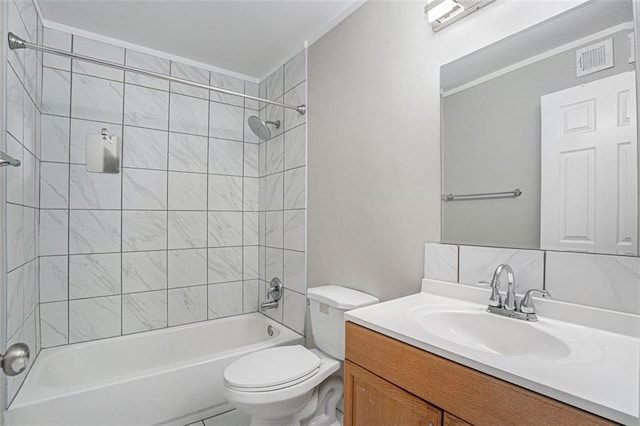 full bathroom with vanity, tiled shower / bath combo, and toilet