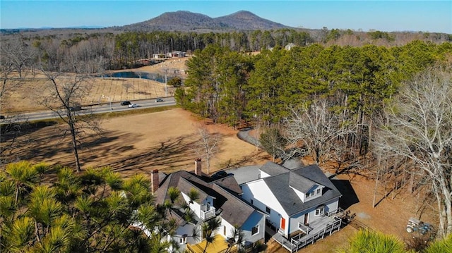 bird's eye view featuring a mountain view and a wooded view