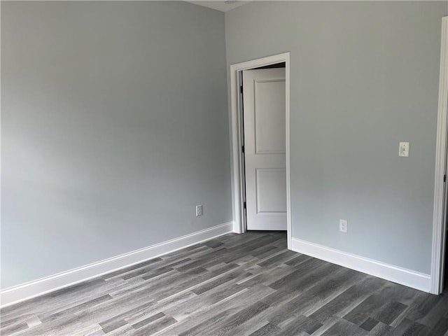 154 Pope Paul Path, Dallas, GA 30132 - unfurnished room with dark wood-type flooring and baseboards