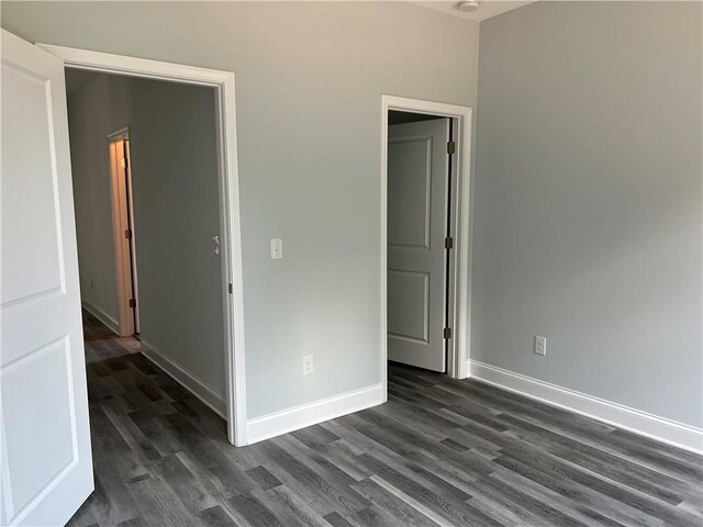154 Pope Paul Path, Dallas, GA 30132 - empty room with baseboards and dark wood-type flooring